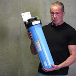 Aidan of Mid Atlantic Water holding a 20 inch Big Blue sediment filter housing to show its size.